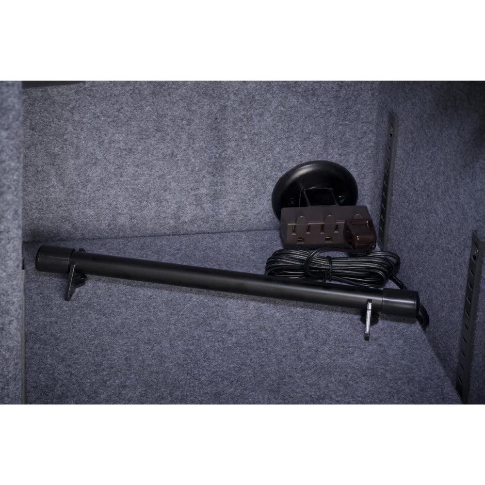 Installation view of the Stack-On SPAD-12 Electronic Safe Dehumidifier mounted inside a safe, featuring a 12-inch black dehumidifier rod with a power cord coiled neatly beside it, set against a grey felt-lined interior