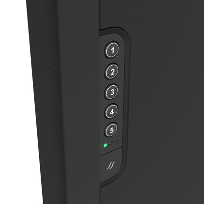 Close-up view of the illuminated electronic keypad on the in-wall safe, offering easy and programmable access.