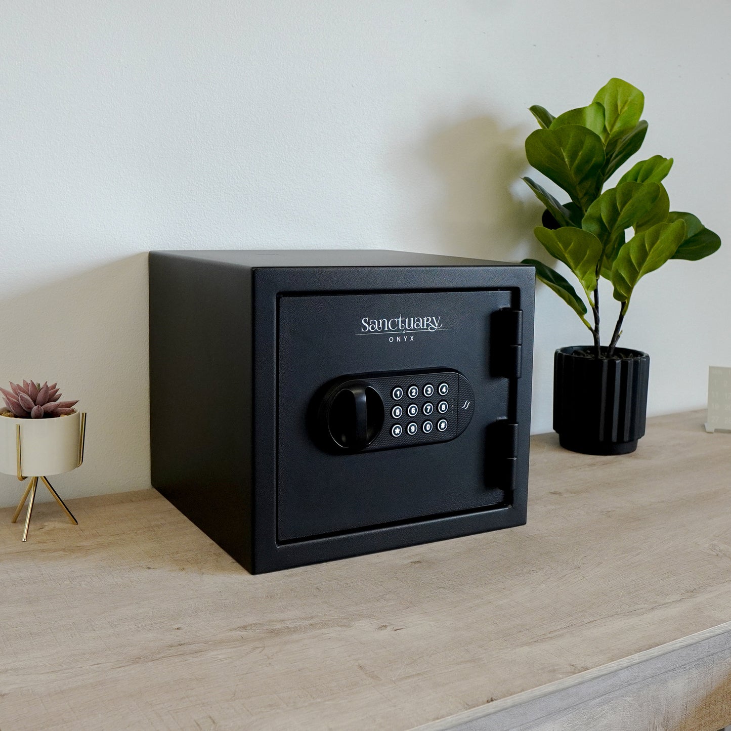 Black fireproof safe with a modern design and carpeted interior.